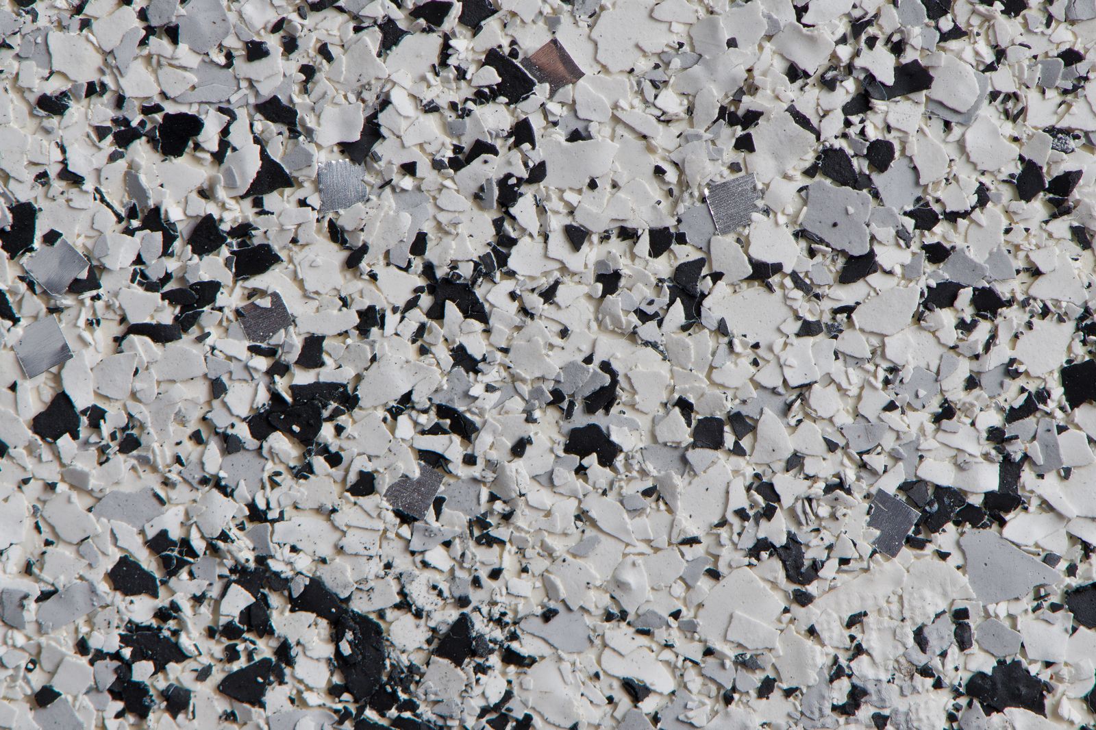 Close-up of a decorative flake epoxy floor blend